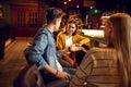 Smiling friends leisures at the counter in bar Royalty Free Stock Photo