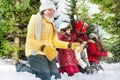 Smiling friends playing with snow in winter woods Royalty Free Stock Photo