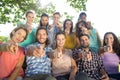 Smiling friends pointing at camera Royalty Free Stock Photo