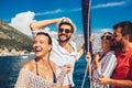 Friends sailing on yacht - vacation, travel, sea, friendship and people concept