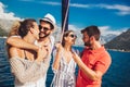 Friends sailing on yacht - vacation, travel, sea, friendship and people concept