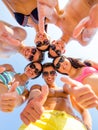 Smiling friends showing thumbs up in circle Royalty Free Stock Photo