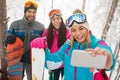 Friends snowboarders or skiers making selfie in fog forest Royalty Free Stock Photo