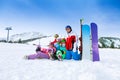 Smiling friends with snowboards in the mountains Royalty Free Stock Photo