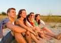 Smiling friends in sunglasses on summer beach Royalty Free Stock Photo