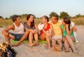 Smiling friends in sunglasses on summer beach Royalty Free Stock Photo