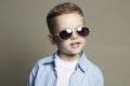 Smiling Funny child.fashionable little boy in sunglasses Royalty Free Stock Photo