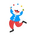 Smiling funny clown in costume juggling with colorful balls during performance in circus Royalty Free Stock Photo