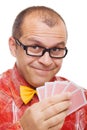 Smiling gambler holding playing cards