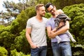 Smiling gay couple with child Royalty Free Stock Photo