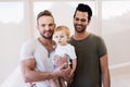 Smiling gay couple with child Royalty Free Stock Photo