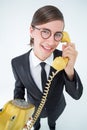 Smiling geeky businessman on the phone