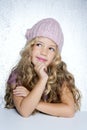 Smiling gesture little girl winter pink cap