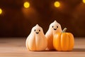 Smiling Ghost Figurines and Pumpkin on Autumn Backdrop