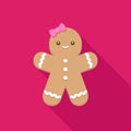 Smiling gingerbread girl with pink bow on bright pink background Royalty Free Stock Photo