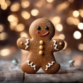 Smiling gingerbread man with bokeh lights in background. Traditional Christmas cookie. Christmas and New Year theme
