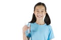 Smiling girl,Asian gril holding a glass of water isolated on white background,Life canÃ¢â¬â¢t live without drinking water. Royalty Free Stock Photo