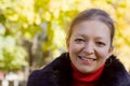 Smiling girl in autumn park Royalty Free Stock Photo