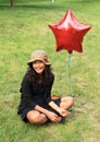 Smiling girl with balloon Royalty Free Stock Photo