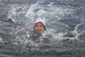 Smiling girl bathes in river