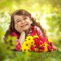 Smiling girl with big bouquet of flowers Royalty Free Stock Photo