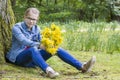 Smiling girl with big bouquet of spring flowers Royalty Free Stock Photo