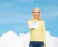 Smiling girl with blank business or name card Royalty Free Stock Photo
