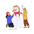 Smiling girl with boy building snowman. Kids playing outdoors on winter holidays. Cute little children having fun in Royalty Free Stock Photo