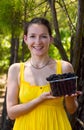 Smiling girl with boysenberries Royalty Free Stock Photo