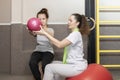 Smiling Girl, Child With Disability Does Physical Exercises With Ball With Support Of Royalty Free Stock Photo