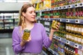 Smiling girl choosing spanish green olives