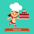 Smiling girl cook holding a big birthday cake Royalty Free Stock Photo