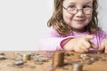 Smiling girl counting money for savings Royalty Free Stock Photo