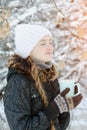 Smiling girl with cup of tea enjoying sun. Winter, outdoors. Sid Royalty Free Stock Photo