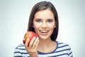 Smiling girl with dental braces holding red apple. Royalty Free Stock Photo