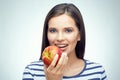 Smiling girl with dental braces holding red apple. Royalty Free Stock Photo