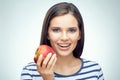 Smiling girl with dental braces holding red apple. Royalty Free Stock Photo