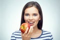 Smiling girl with dental braces holding red apple. Royalty Free Stock Photo