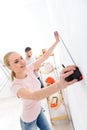 Smiling girl doing measurements with tape measure Royalty Free Stock Photo