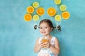 Smiling girl drinks fresh orange juice Royalty Free Stock Photo