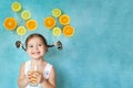 Smiling girl drinks fresh orange juice Royalty Free Stock Photo