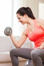 Smiling girl exercising with dumbbells Royalty Free Stock Photo