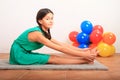 Smiling girl exercising yoga - seated forward fold Royalty Free Stock Photo