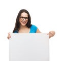 Smiling girl with eyeglasses and white blank board Royalty Free Stock Photo