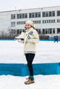Smiling girl with fads on ice skating rink Royalty Free Stock Photo