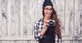 Smiling girl in glasses with vintage camera Royalty Free Stock Photo