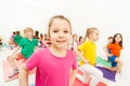 Smiling girl going in for gymnastics with friends Royalty Free Stock Photo