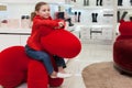 Smiling girl having fun in a big red toy Royalty Free Stock Photo