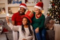 Smiling girl with her parent taking selfie on Christmas Royalty Free Stock Photo