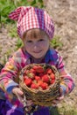 Smiling girl hold basket full of strawberries Royalty Free Stock Photo